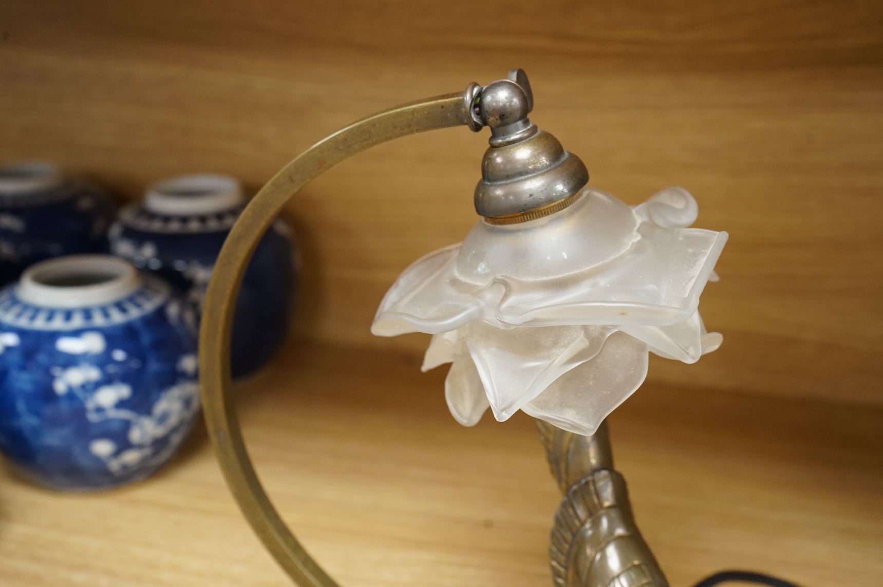 An Art Deco table lamp in the form of a bird with tchecoslovaquie glass shade, 26cm high